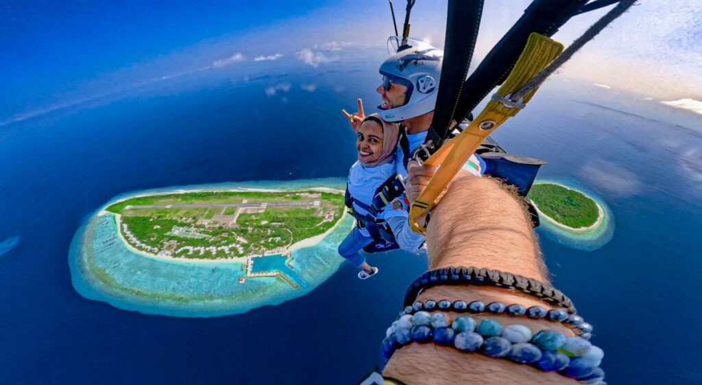 A women skydiving over the Maldives