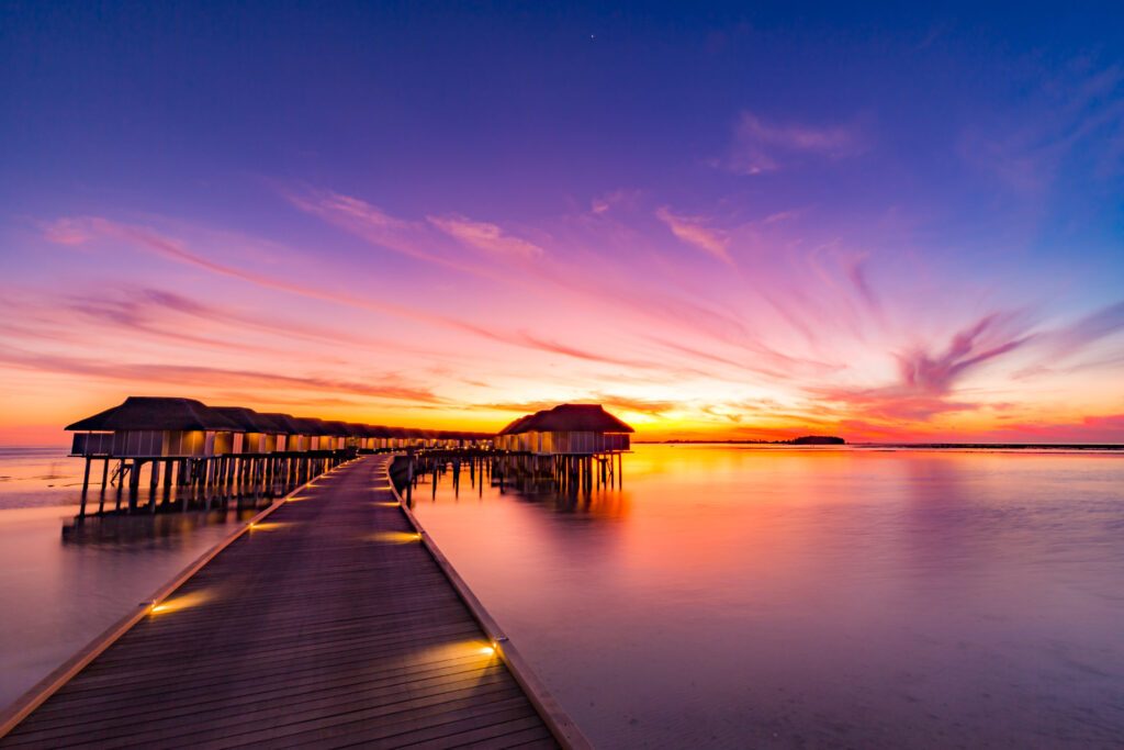 Sunset from an overwater villa in the Maldives is unlike anything else on earth - Luxury Escapes