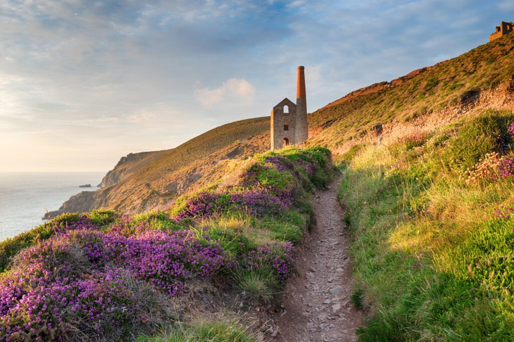 Summer on the South West Coast Path at Wheal Coates as it approaches St Agnes Head on the Cornwall coast