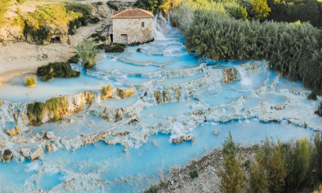 Tiers of bright blue hot springs at Terme di Saturnia, Italy - Luxury Escapes 