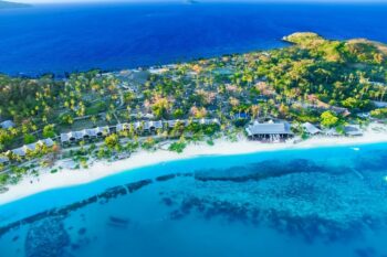 An aerial view of Mana Island Resort & Spa Fiji, which is one of the best all-inclusive resorts in Fiji - Luxury Escapes