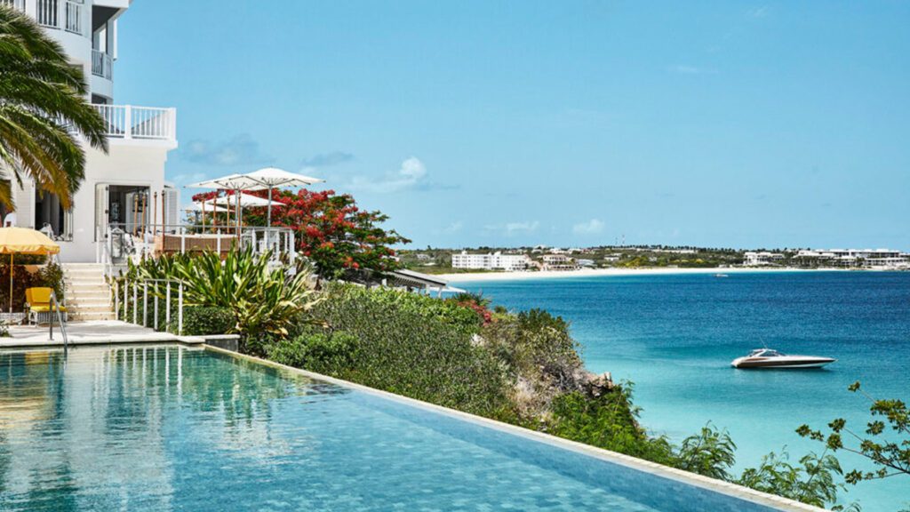 Caribbean beachfront resort in Anguilla, overlooking the ocean from the infinity pool - Luxury Escapes