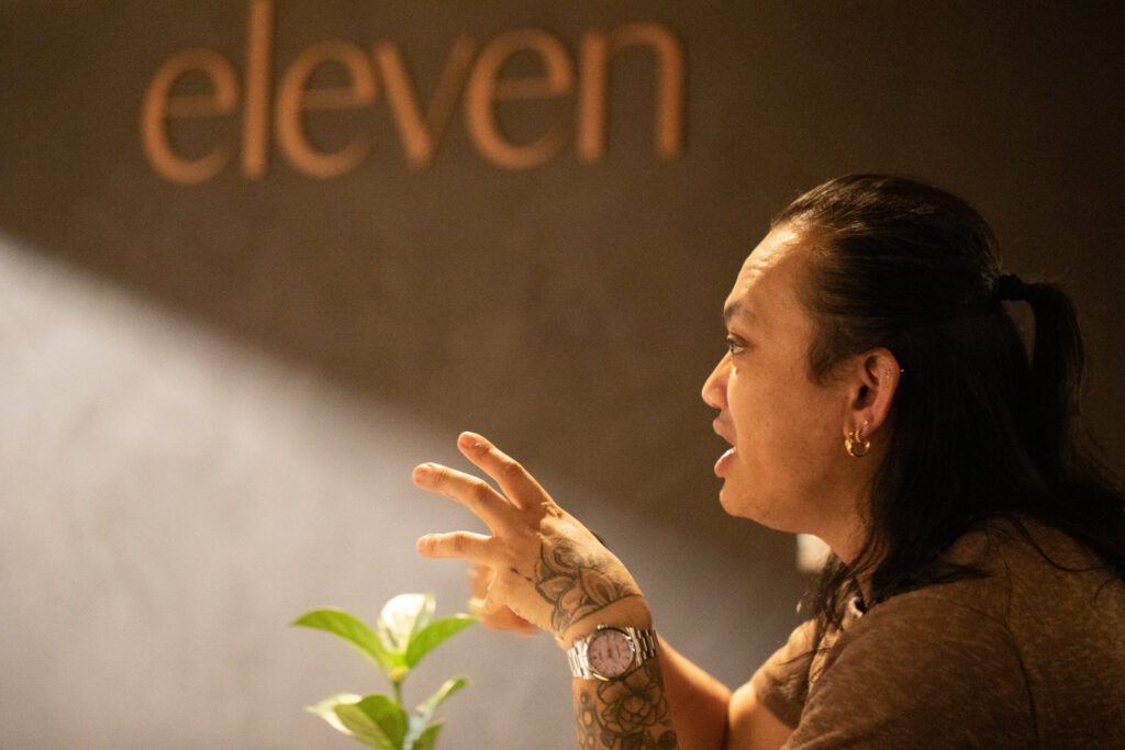 MasterChef Khanh Ong in an intense conversation at Eleven Restaurant, a French-inspired restaurant - Luxury Escapes