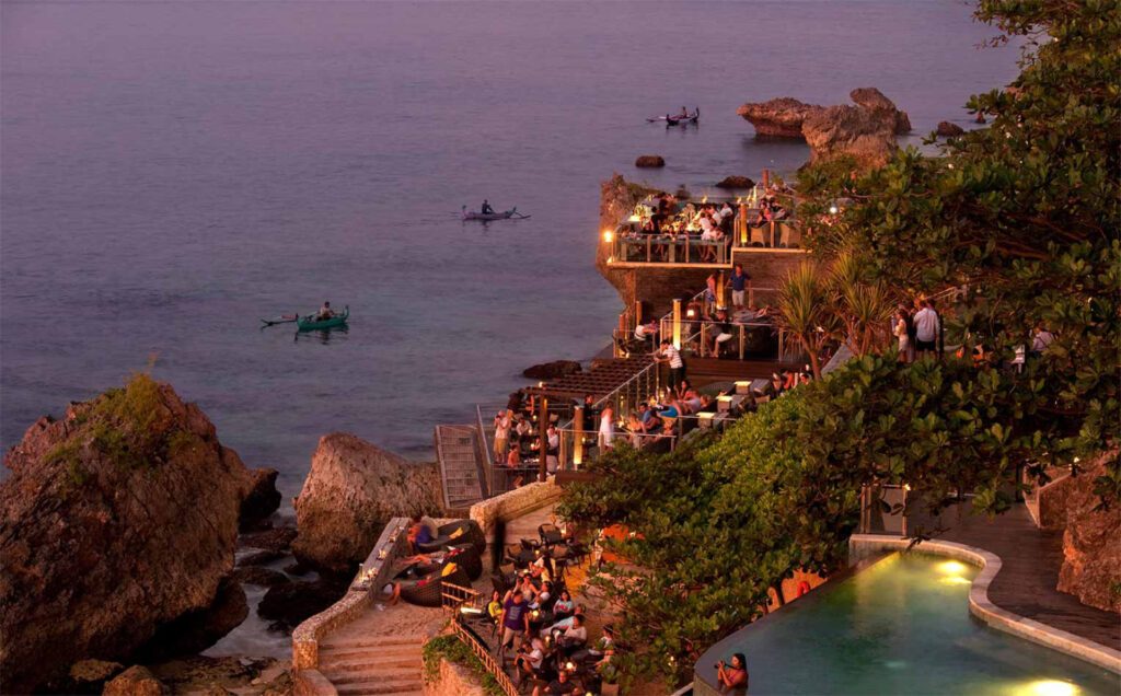 An image of the happening Rock Bar Bali in the evening - Luxury Escapes