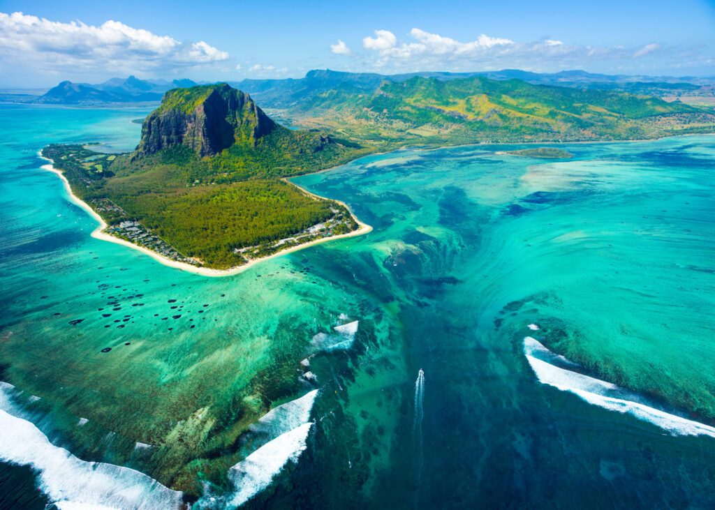 A helicopter ride to see an underwater waterfall in Mauritius is a top activity to do in this island country – Luxury Escapes