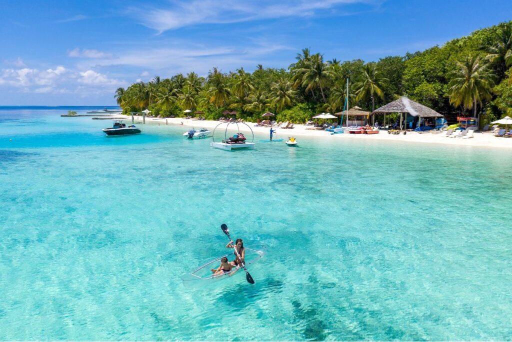 Kayaking at Lily Beach Resort & Spa, a highlight at one of the Maldives' best family-friendly resorts - Luxury Escapes