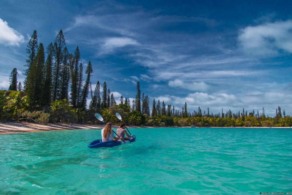 When planning your New Caledonia escape, don't skip a visit to the Isle of Pines' blue waters and stunning beaches. 
