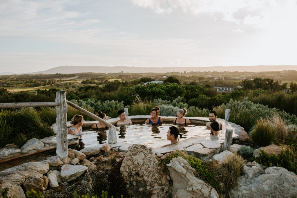 A group enjoying the Peninsula Hot Springs in Victoria - Luxury Escapes