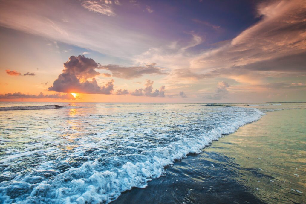 A sunset shot of the Seminyak beach in Bali, near the bestselling Double-Six Resort - Luxury Escapes