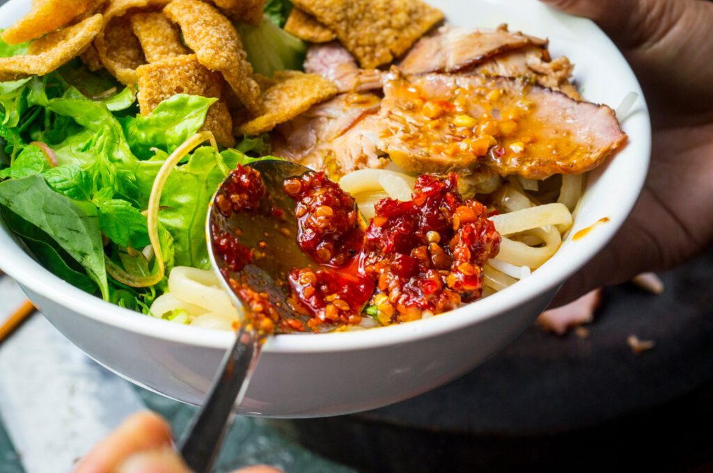 A delicious bowl of cao lau at Than Cao Lau's is a must-try when in Hoi An, Vietnam – Luxury Escapes