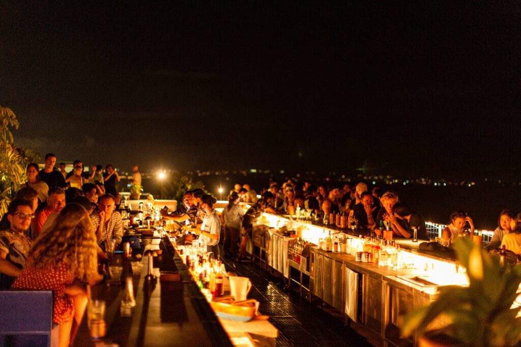 Night time at the bar at Potato Head Beach Club, one of Bali's most legendary beach clubs