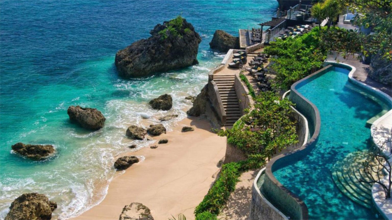 RIMBA Jimbaran Bali by AYANA and it's outdoor swimming pool overlooking a private beach - Luxury Escapes