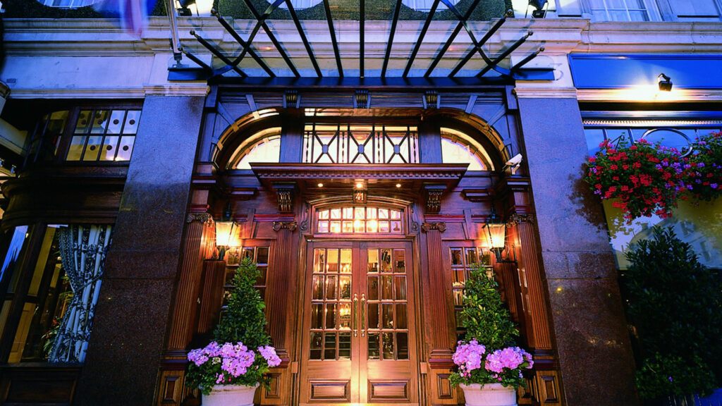 Hotel 41 entrance at twilight with||London's best boutique hotels - The Atheneuum hotel lobby interior with vibrant decor and contemporary design|||London's best boutique hotels - The Montague on the Gardens front entrance with a doorman out the front|London's best boutique hotels - Henrietta Hotel London Eye View Room|| - Luxury Escapes