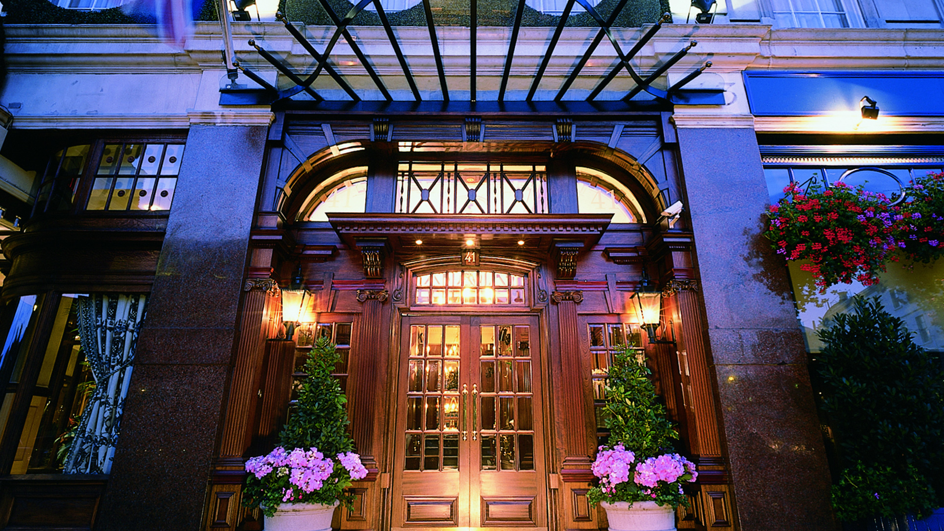 Hotel 41 entrance at twilight with||London's best boutique hotels - The Atheneuum hotel lobby interior with vibrant decor and contemporary design|||London's best boutique hotels - The Montague on the Gardens front entrance with a doorman out the front|London's best boutique hotels - Henrietta Hotel London Eye View Room||