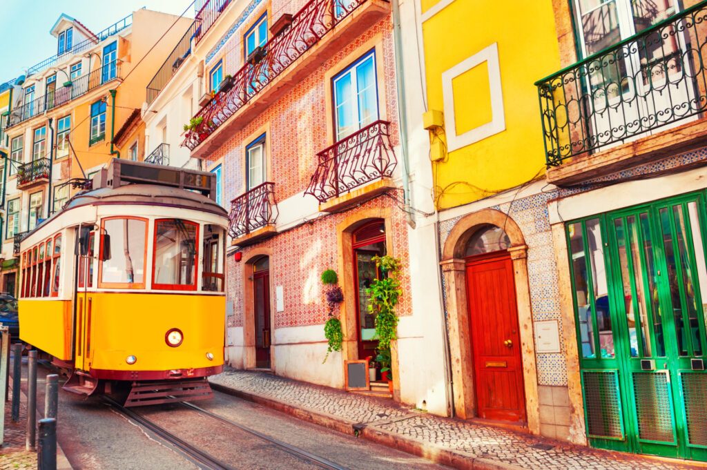 The hilly route of Lisbon's number 28 tram is just one of the many wonders that await solo travellers in Portugal - Luxury Escapes