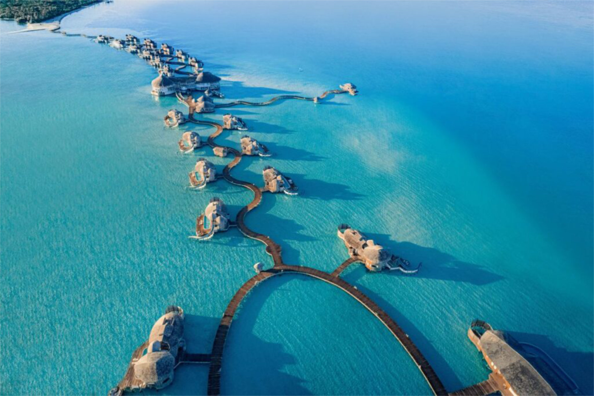 A aerial view of the Sovena Jani overwater villas one of the most luxurious resorts in the Maldives - Luxury Escapes