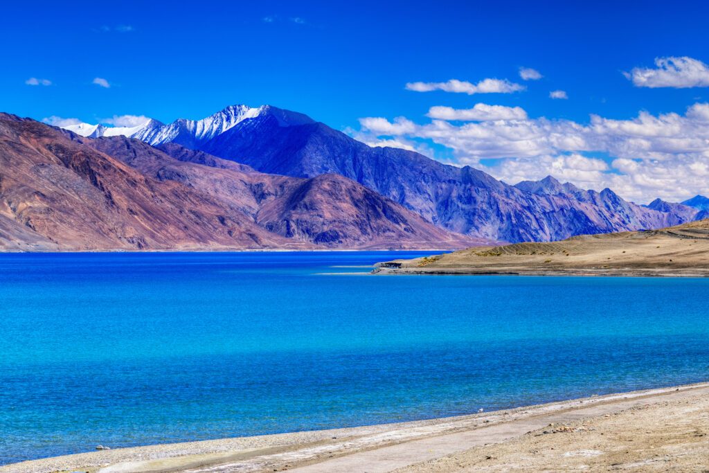 The crystal-clear waters of Pangong Lake are one of the highlights of a visit to the Ladakh region - Luxury Escapes