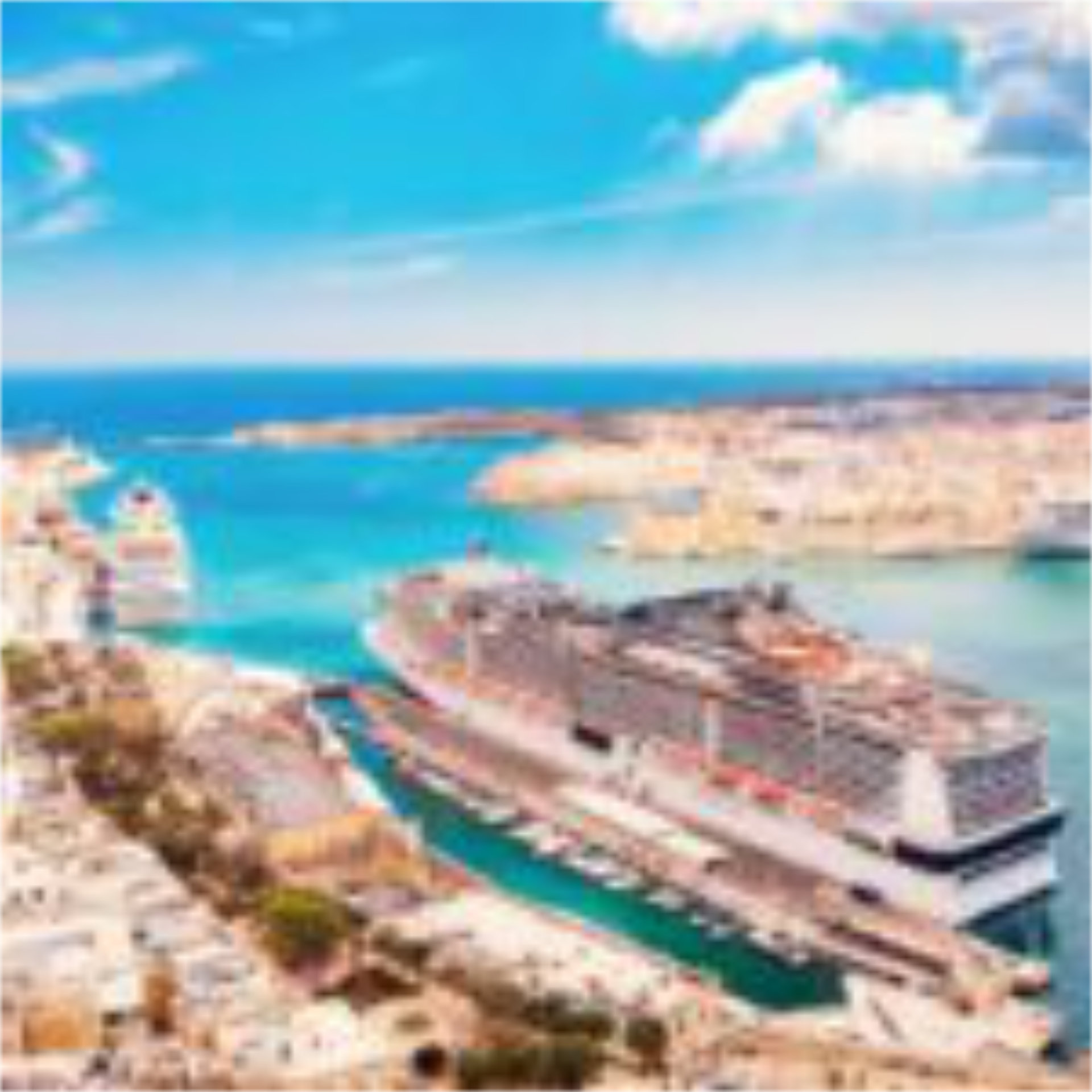 A cruise ship, docked in port in Europe.