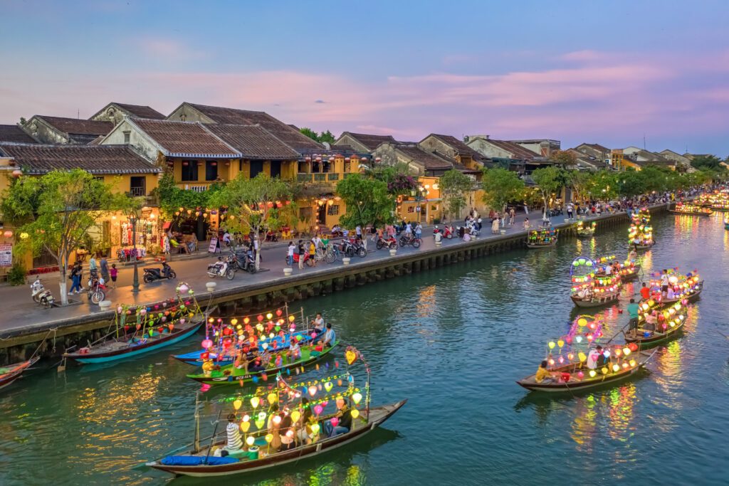 The river through Hoi An in Vietnam, one of the best places to tour in 2024 - Luxury Escapes
