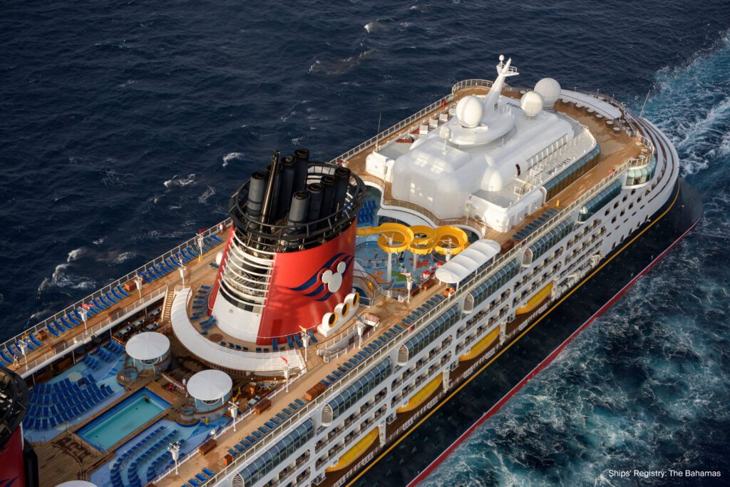 Ariel photo of Disney Cruise Line's Disney Wonder sailing in Australian waters, to illustrate why you should book with Disney Cruise Line for 2024 - Luxury Escapes