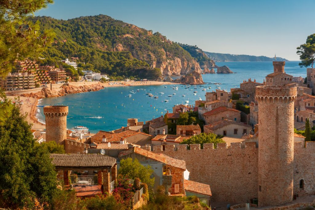 A magnificent shot of Fortress Vila Vella, Spain - Luxury Escapes