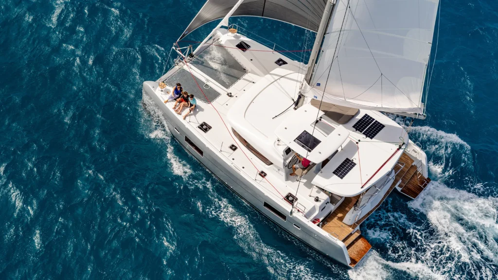 A family enjoying a ride across the Great Barrier Reef, one of Queensland's most unique stay - Luxury Escapes