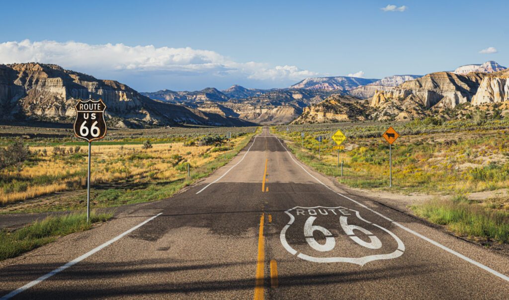 View from the centre of the USA road Route 66 looking over the mountains for one of the 5 iconic USA road trips - Luxury Escapes 