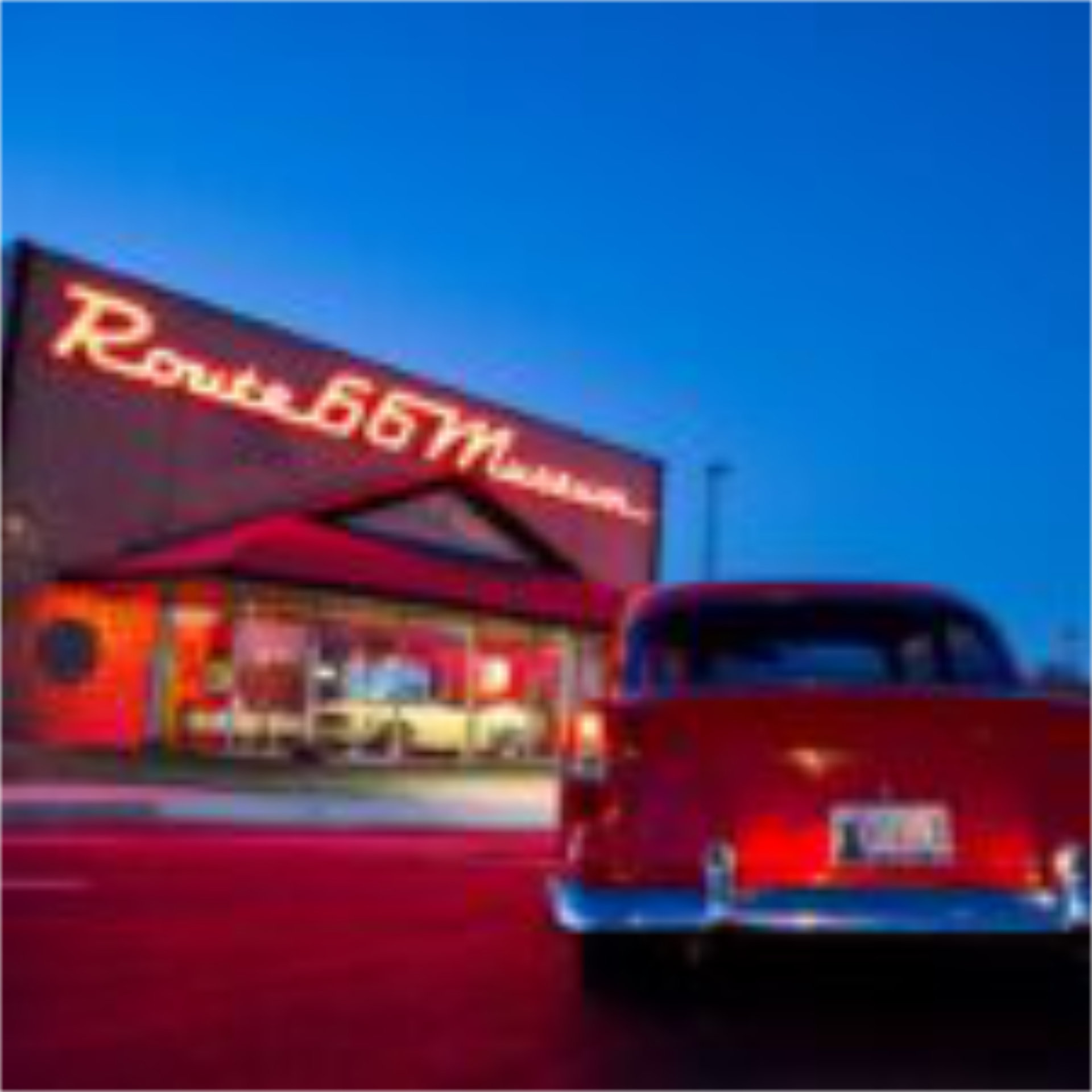 Image of a classic USA diner with a retro car out the front, a cultural classic experience - Luxury Escapes
