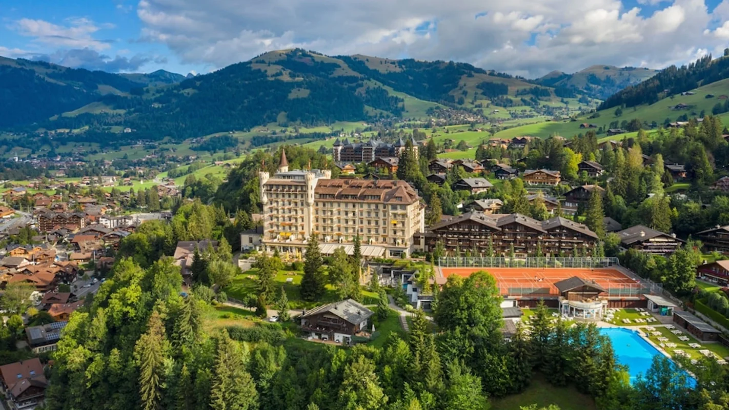 An aerial view of Gstaad Palace in Switzerland, one of the world's most extraordinary heritage hotels - Luxury Escapes