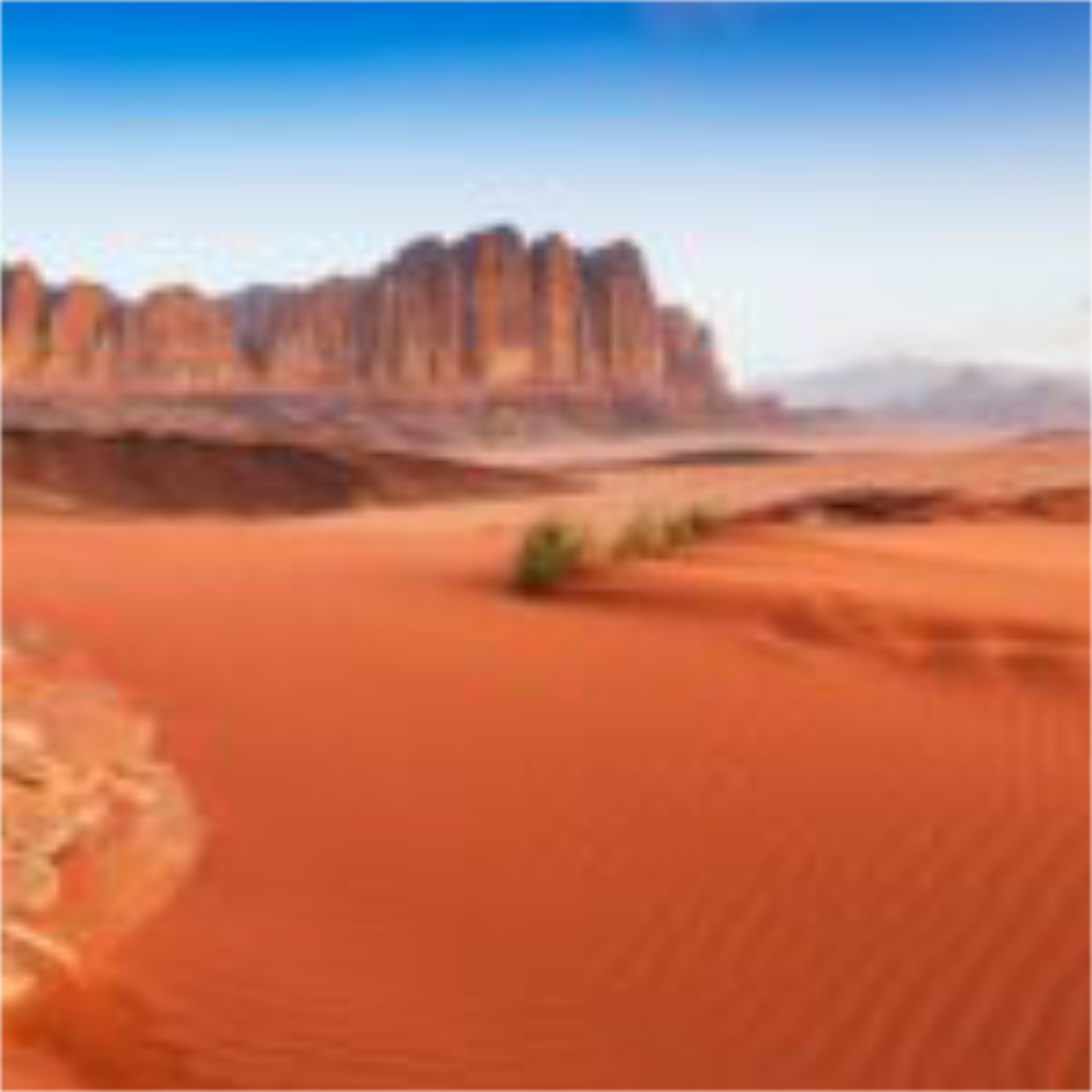 A rich red and orange desert landscape in Wadi Rum, Hollywood's favourite alien landscape, one of the top 10 filming locations for set-jetting travellers