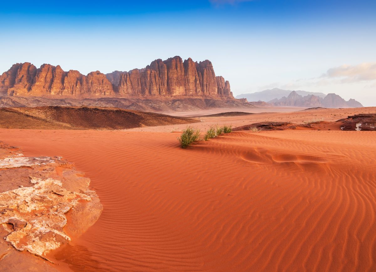 A rich red and orange desert landscape in Wadi Rum, Hollywood's favourite alien landscape, one of the top 10 filming locations for set-jetting travellers