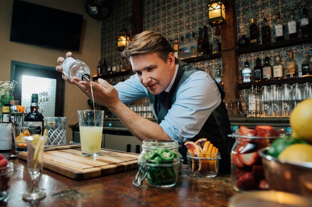 A bartender displaying hot to make a cocktail in the Princess ScholarShip@Sea Program, one of the 5 Experiences You Can Only Have with Princess Cruises  - Luxury Escapes 