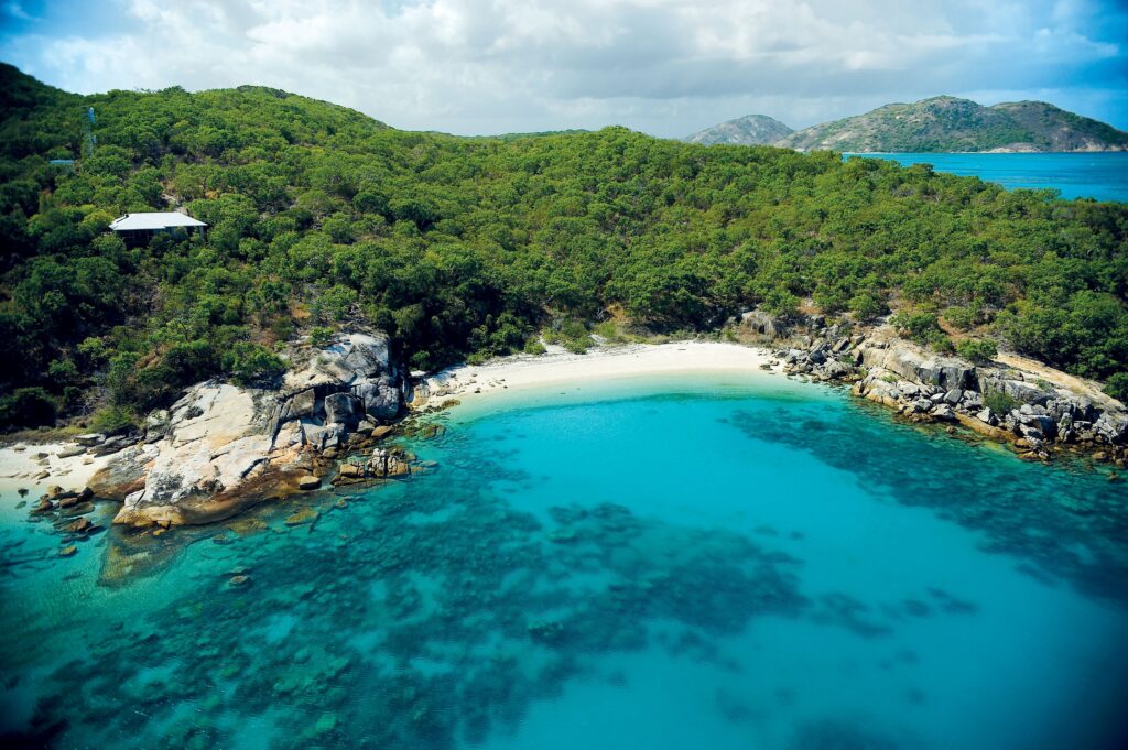 Aerial view of Lizard Island and the turquoise waters surrounding - Luxury Escapes 