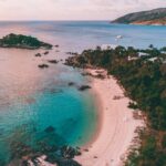 Aerial view of Lizard Island's stunning coastline, perfect for relaxing and exploring - Luxury Escapes