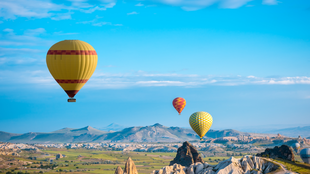 Hot air balloons over Cappadocia, Turkey, one of the best places to travel on a Luxury Escapes tour
