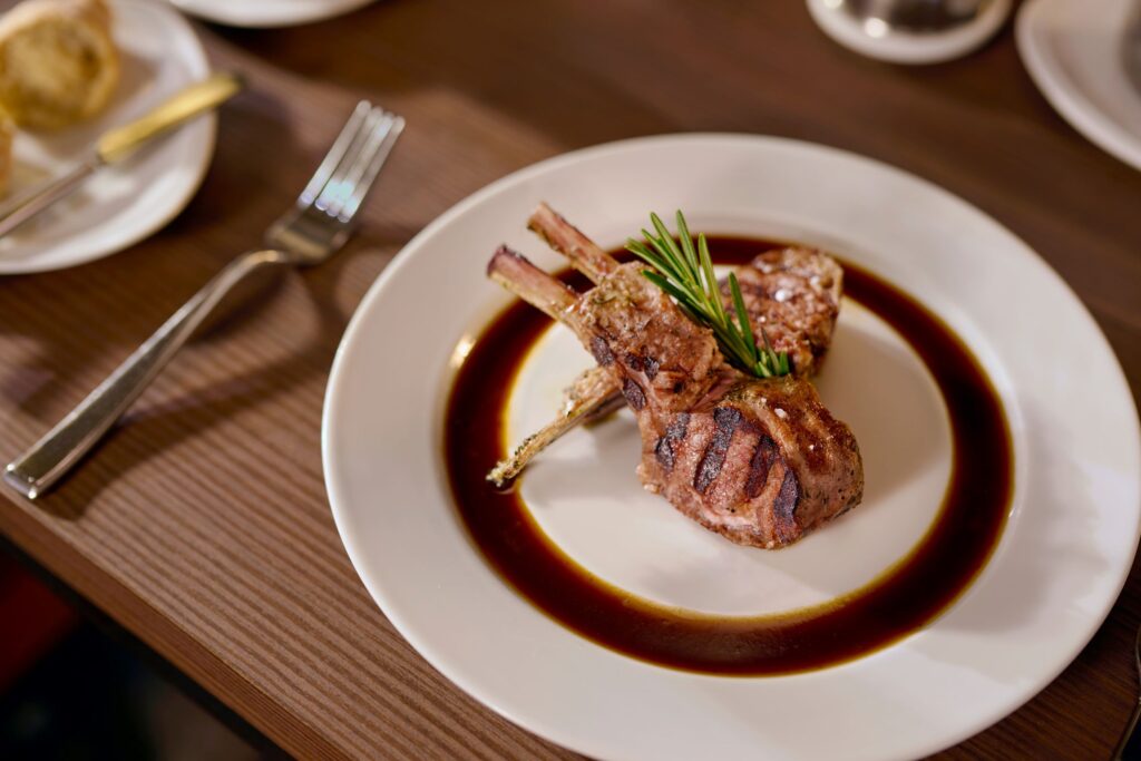 Chops on a plate at Chops Grille onboard a Royal Caribbean cruise, one of the best restaurants at sea