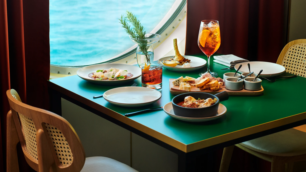 Dining at Razzle Dazzle onboard the Scarlet Lady, a Virgin Voyages cruise, one of the best restaurants at sea