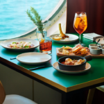 Dining at Razzle Dazzle onboard the Scarlet Lady, a Virgin Voyages cruise, one of the best restaurants at sea