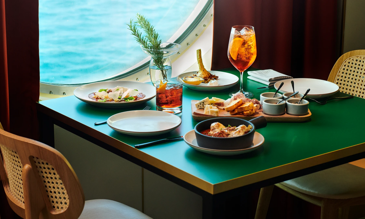 Dining at Razzle Dazzle onboard the Scarlet Lady, a Virgin Voyages cruise, one of the best restaurants at sea