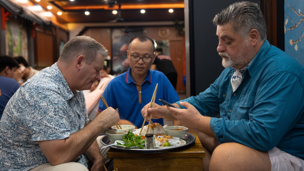 Gary Mehigan and Matt Preston eat at a street food vendor - Luxury Escapes