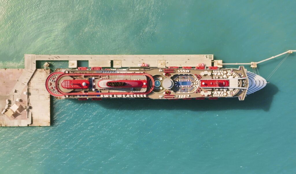 An aerial view of the Virgin Voyages' Valiant Lady, one of the ships where Luxury Escapes: The World's Best Holidays was filmed.