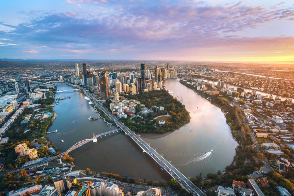 An aerial view over Brisbane and the Brisbane River, which weaves through the city. Brisbane's riverside precincts are just one reason the city is one of Australia's coolest capital cities.