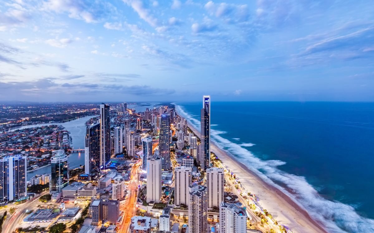 The sunset view of Gold Coast from the height of the Q1 Resort skyscraper building is one of the best spots to watch the sunset - Luxury Escapes