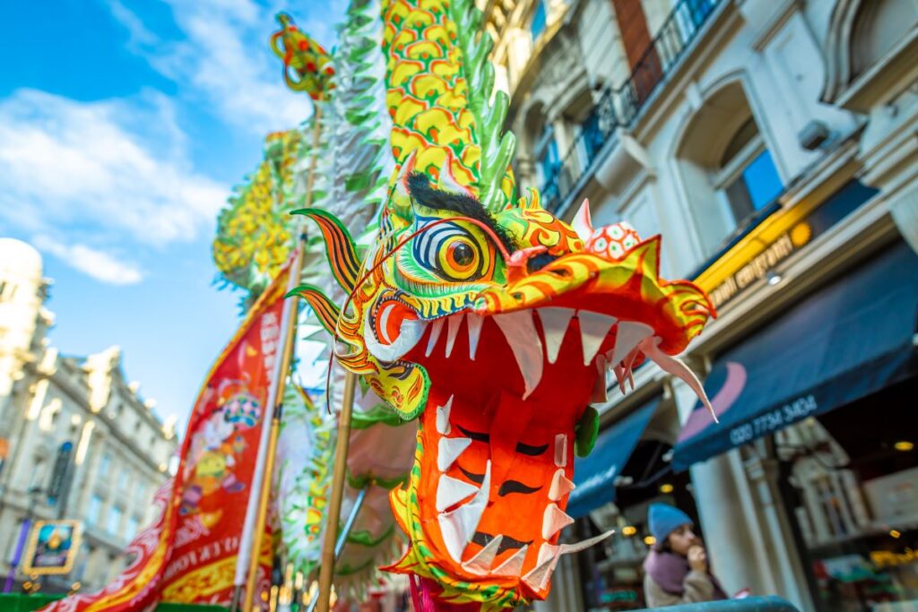 The Chinese dragon as it makes its way through London to celebrate the 2024 Lunar New Year - Luxury Escapes