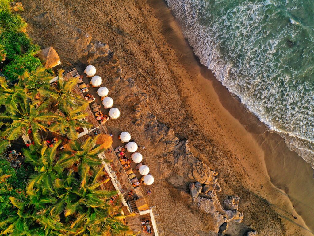 An aerial view of a beach in Canggu, an area of Bali where you can find some of the best restaurants in Bali - Luxury Escapes