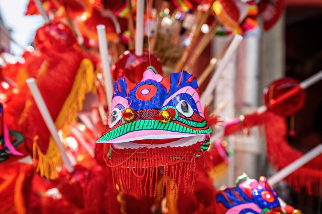 A colourful dragon head decoration in the streets of Bangkok to celebrate the 2024 Lunar New Year festivities - Luxury Escapes