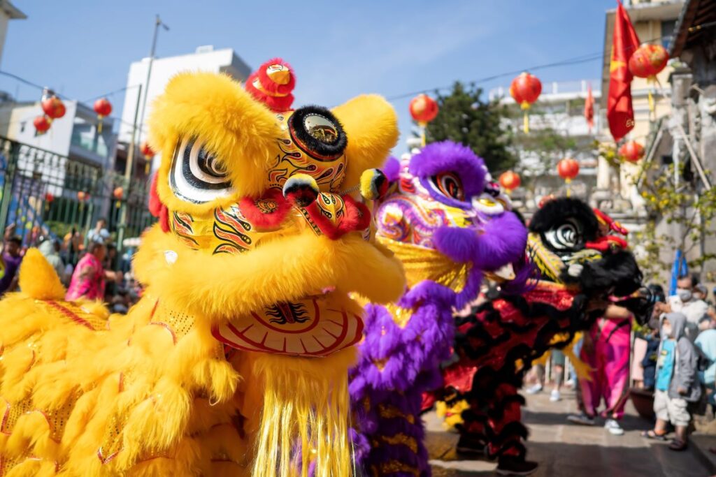 Lion dancers in full costume for the New Year, one of the traditions for Lunar New Year.