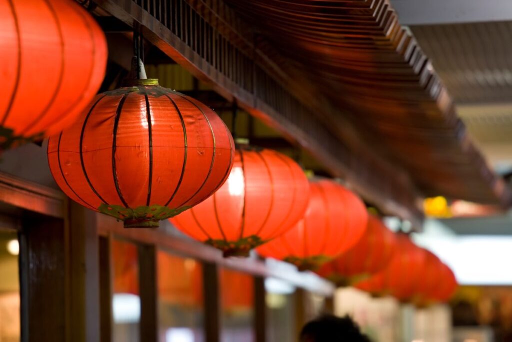 Red lanterns in Sydney's Chinatown sets the theme for the 2024 Lunar New Year celebrations across the city - Luxury Escapes