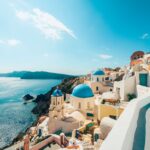 A scenic cliff face in Oia, Santorini, Greece – one of the most popular destinations in Europe to visit during the summer - Luxury Escapes