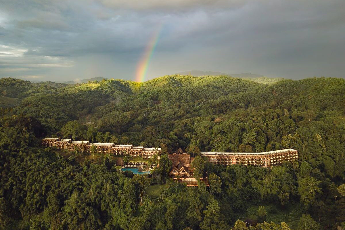 Aerial view of Anantara Golden Triangle Elephant Camp & Resort surrounded by lush forest which is one of the most outstanding stays in Thailand's golden triangle - Luxury Escapes